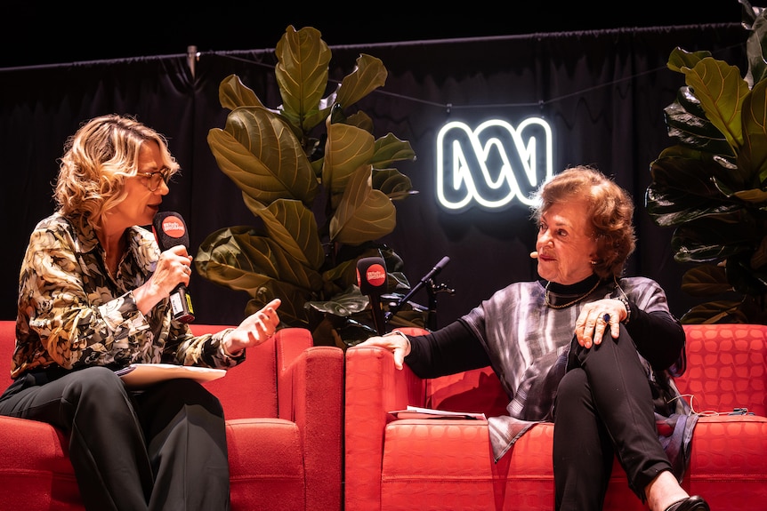 A woman responds to an interviewee's questions