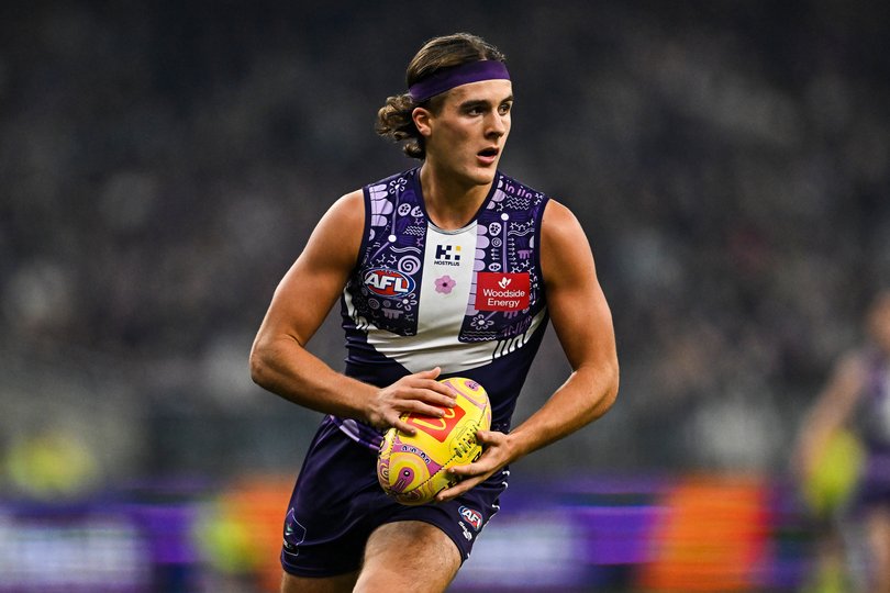 Murphy Reid runs with the footy.