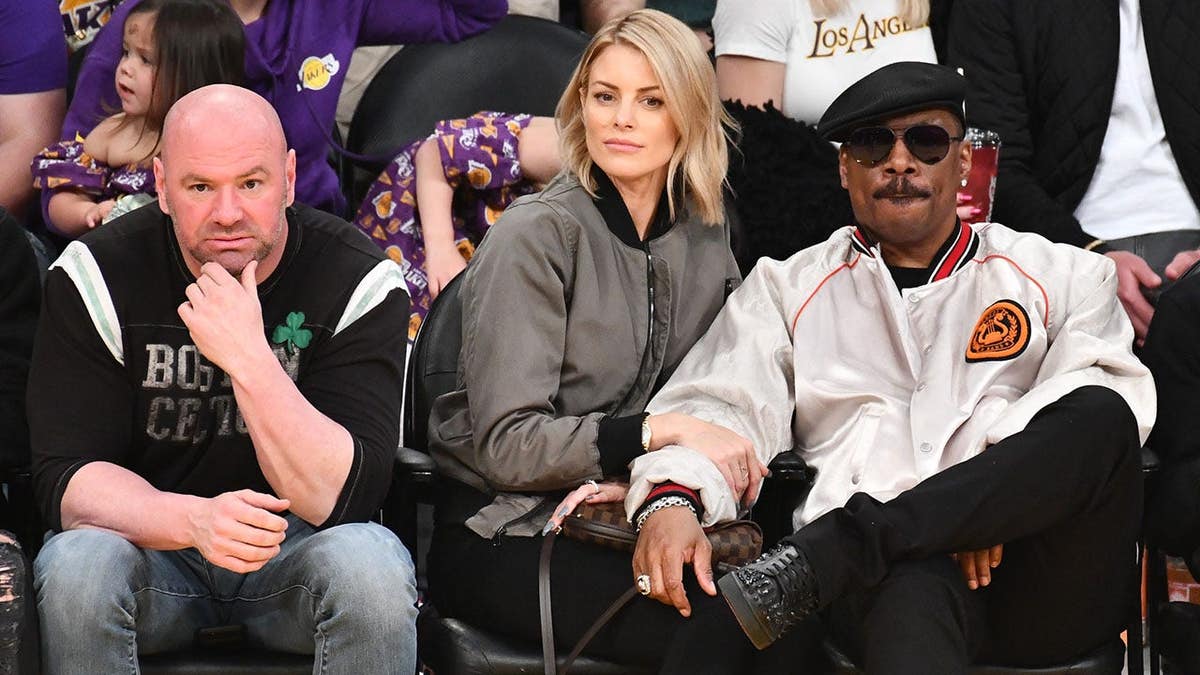 Dana White, Paige Butcher and Eddie Murphy attending a basketball game at Staples Center