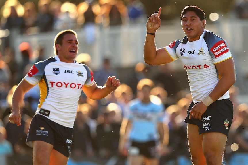Taumalolo celebrates a try during a rugby league match.