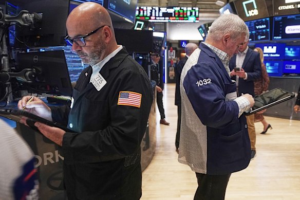 Wall Street is back near record highs after more strong company results and a decline in oil prices.