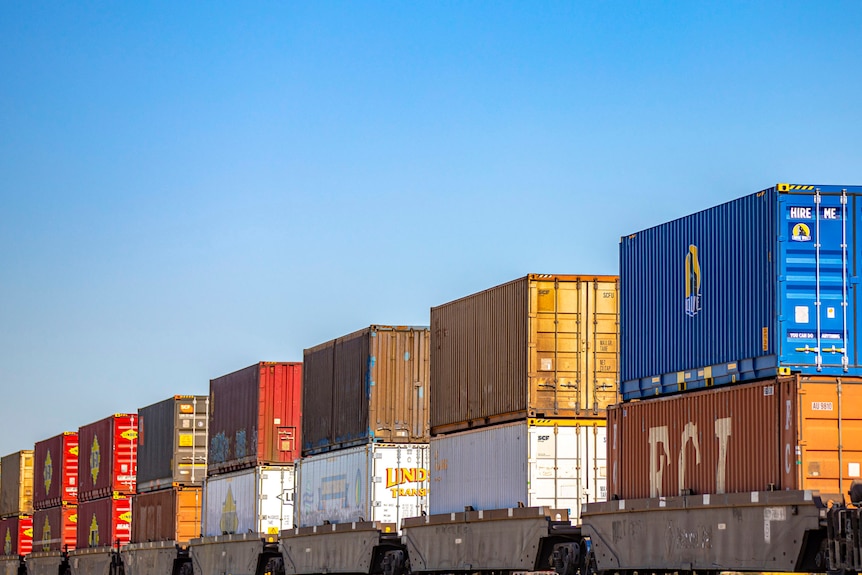 shipping containers stacked on a train