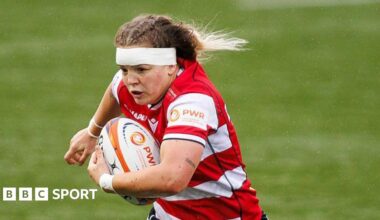 Georgia Brock runs with a rugby ball wrapped under her left arm during a match for Gloucester-Hartpury this season