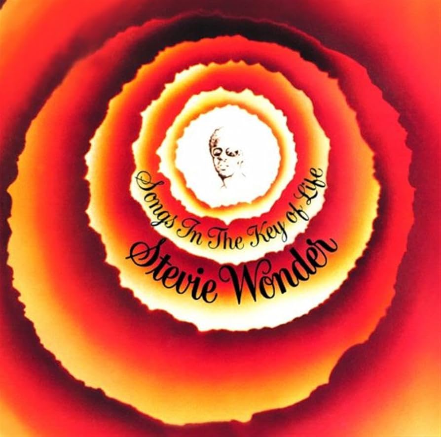 Album cover featuring a drawing of a man wearing glasses at the centre of a flower