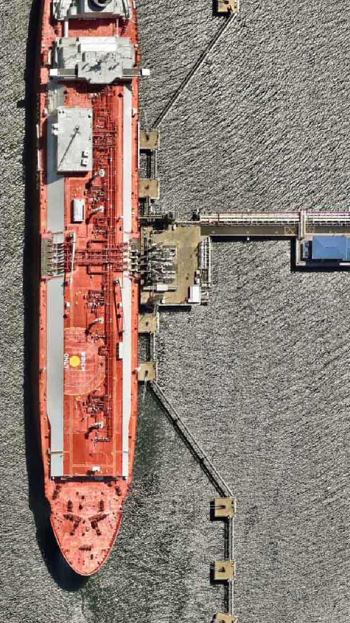 An aerial view of an LNG cargo tanker moored at Curtis Island.