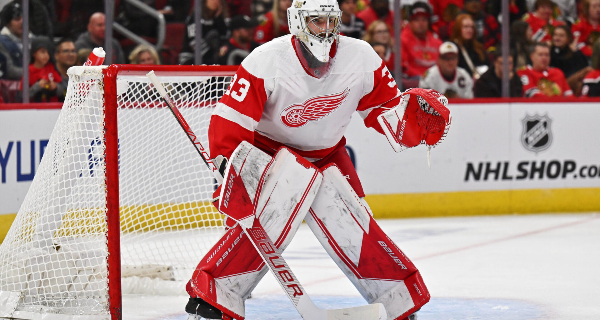 Detroit Red Wings goaltender Sebastian Cossa (33) defends the net at United Center