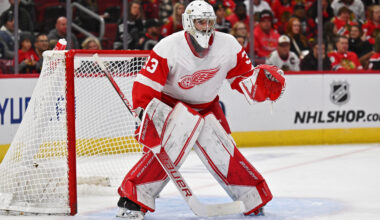 Detroit Red Wings goaltender Sebastian Cossa (33) defends the net at United Center