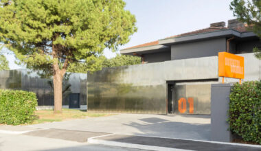mirrored aluminum facade blurs social space into the italian landscape