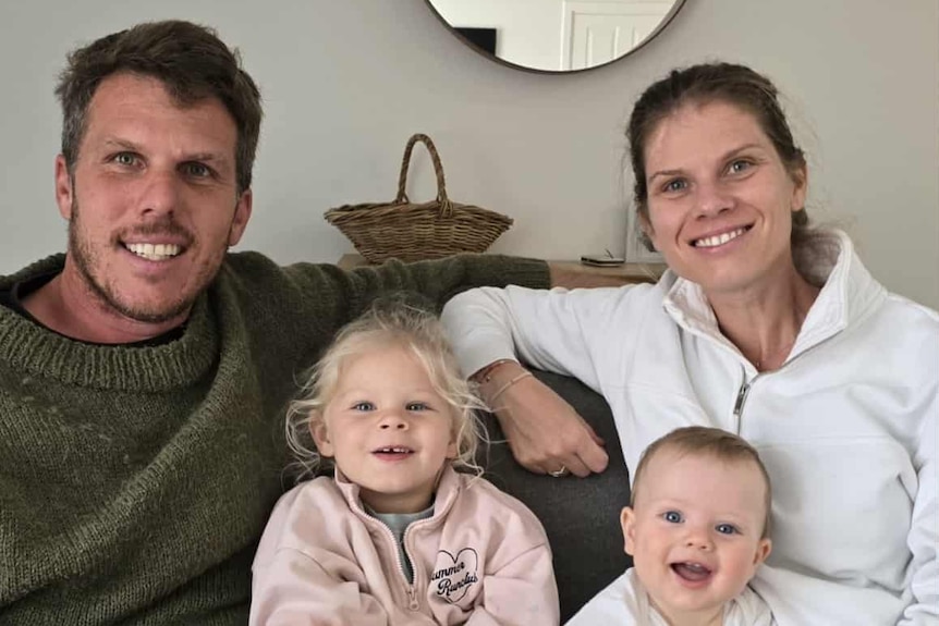 Steven Mattaboni smiling with his daughter, sister and sister's baby.