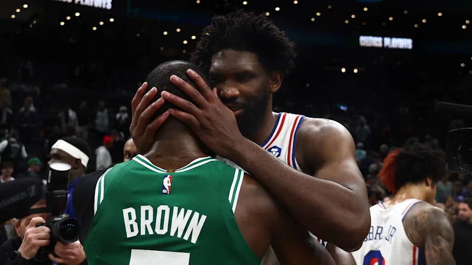 Boston Celtics' Jaylen Brown and Philadelphia 76ers' Joel Embiid greet each other after gameWinslow Townson-Imagn Images