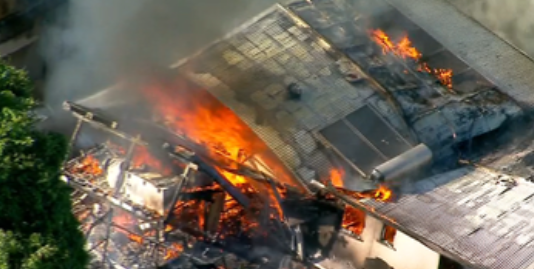 Smoke seen billowing from the two engulfed properties.
