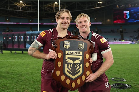Cameron Munster and Tom Dearden with the Origin shield in 2025.