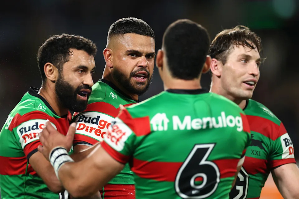 Latrell Mitchell celebrates scoring a try.