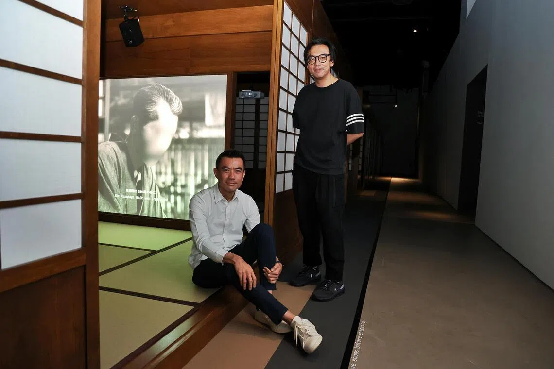 Dr Eugene Tan (seated) with Singapore artist Ho Tzu Nyen at Ho’s solo exhibition Time & The Tiger at Singapore Art Museum.