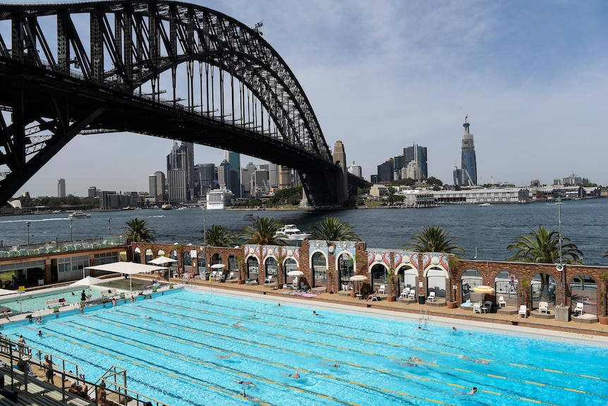 People are seen swimming in North Sydney Olympic Pool in Sydney