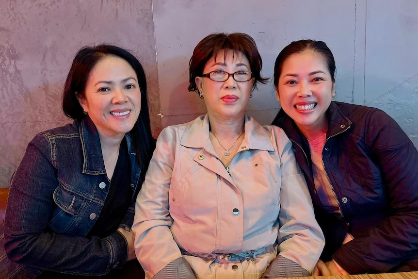 Cindy Mai, left, with her mother and sister