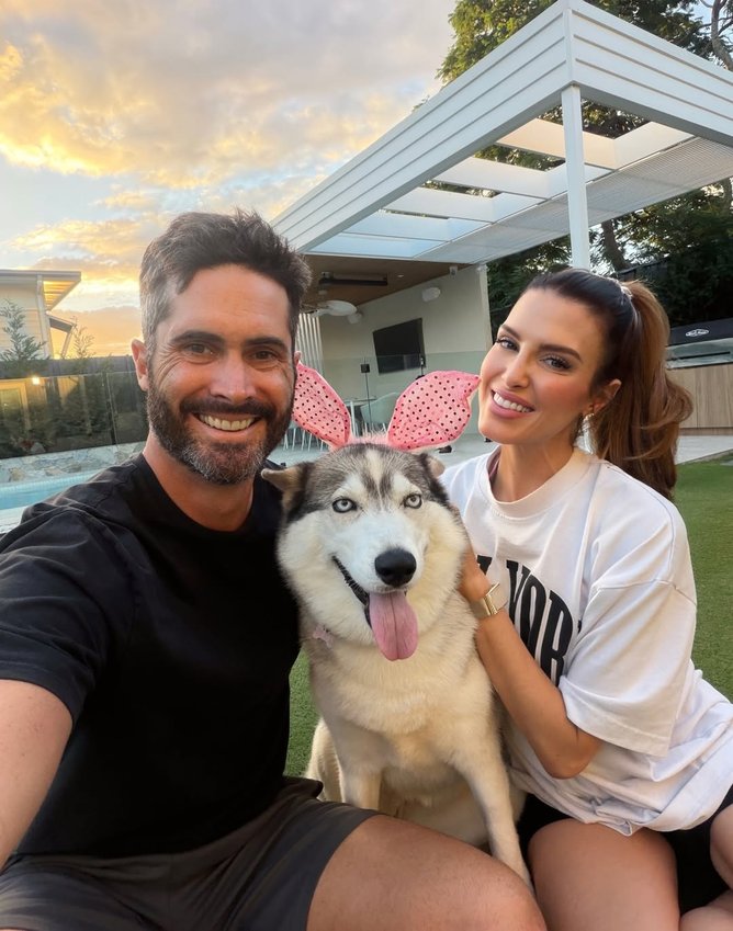 Ben Cutting and Erin Holland with their husky.
