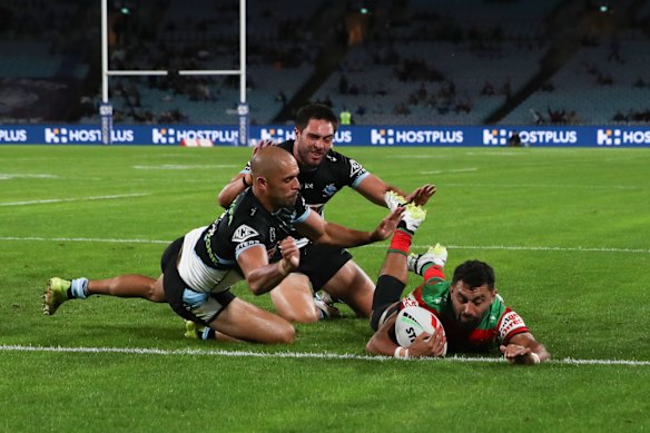 Alex Johnston crosses for one of his three tries.
