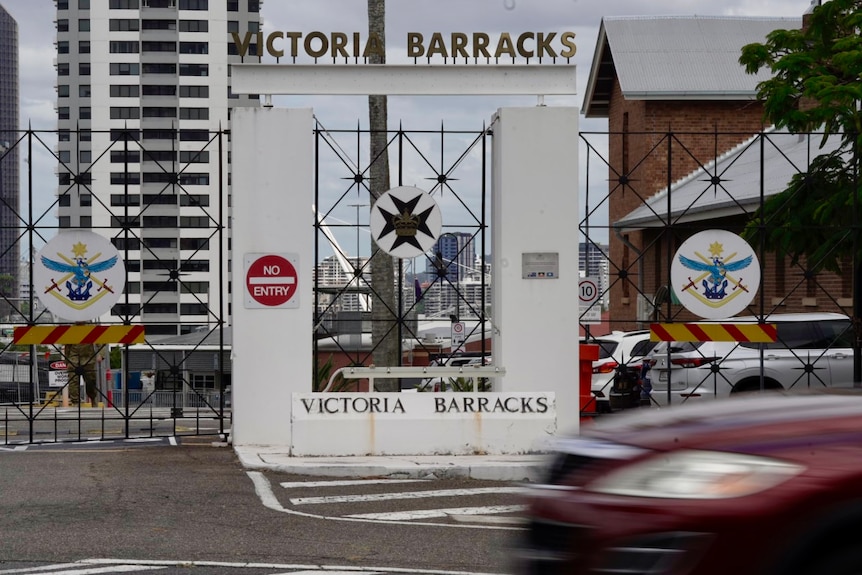 A gate below a sign reading victoria barracks