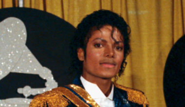 Singer Michael Jackson is shown with two armfuls of award statues at the 1984 Grammy Awards.