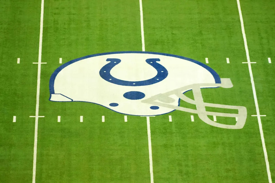 Feb 25, 2025; Indianapolis, IN, USA; The Indianapolis Colts helmet logo at midfield at Lucas Oil Stadium. Mandatory Credit: Kirby Lee-Imagn Images