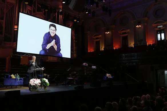 David Hobson speaks at the memorial for ABC presenter James Valentine at the Town Hall in Sydney.
