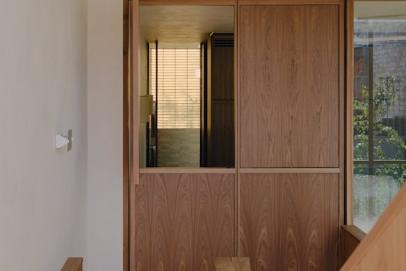 Barn-style doors lead to the bedroom and can be left open.