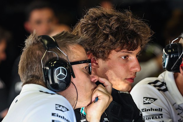 Kimi Antonelli sits in the Mercedes garage with his race engineer Peter Bonnington.