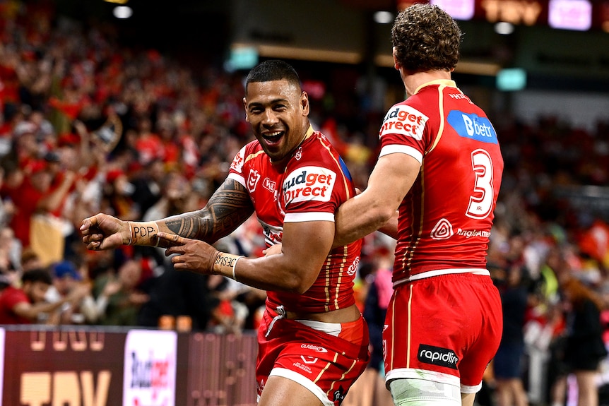 Jamayne Isaako celebrates a Dolphins try with Jack Bostock.