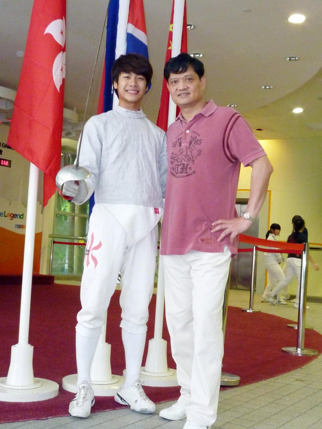 Jackson Wang with his father in 2010. Before he became a singer, Wang was a champion fencer. Photo: SCMP