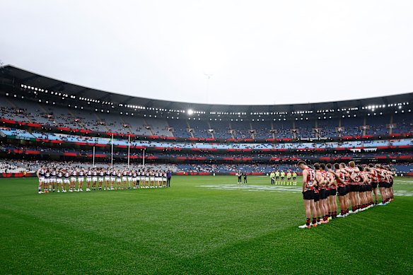 Essendon and Fremantle players lined up for the Welcome to Country in front of only 25,100 fans.