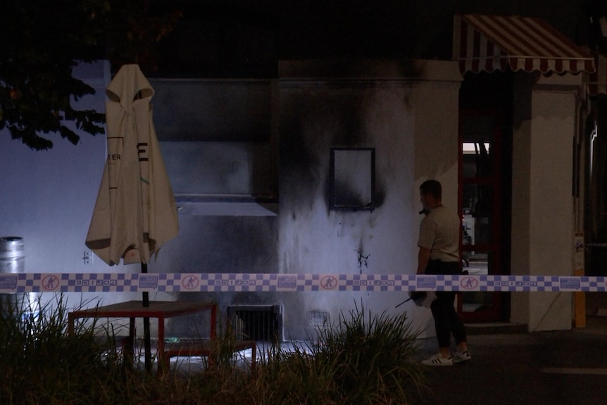 Black smoke marks darken the white walls of a hotel.