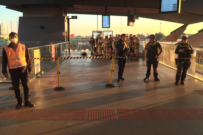 Emergency services personnel inside a Melbourne train station.