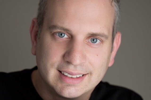 A man smiling.