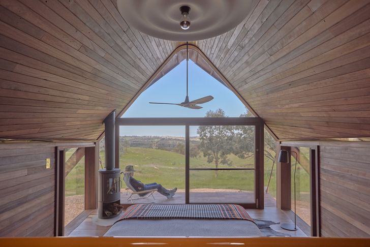 An expansive deck opens to long views over the rolling countryside.