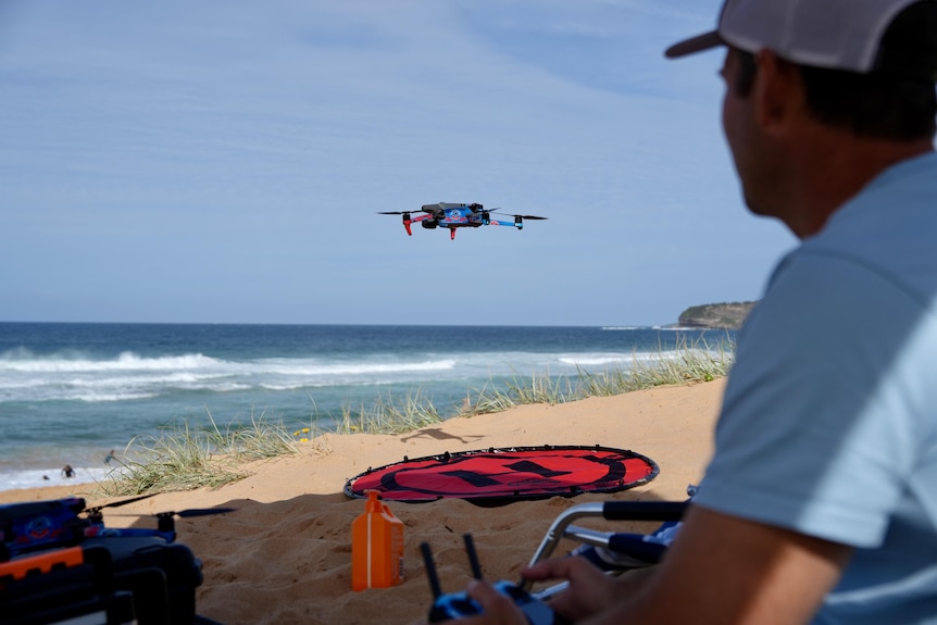 Mike Psillakis operating a drone