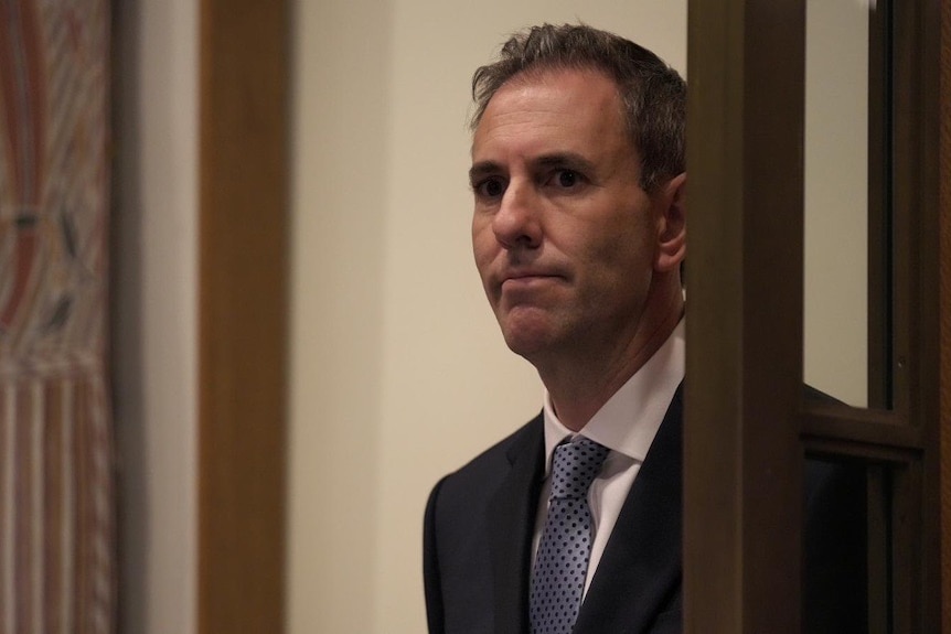 a man in a suit looking serious