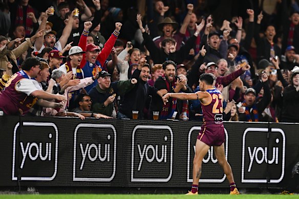 Charlie Cameron of the Lions celebrates in front of fans.
