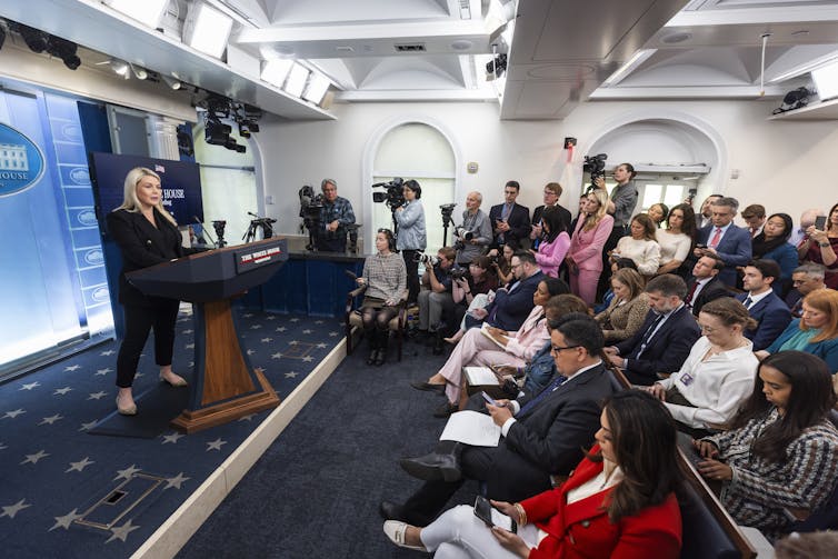 White House press secretary addresses the press in the Press Briefing Room.