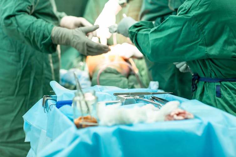 Medical professionals in an operating theatre.