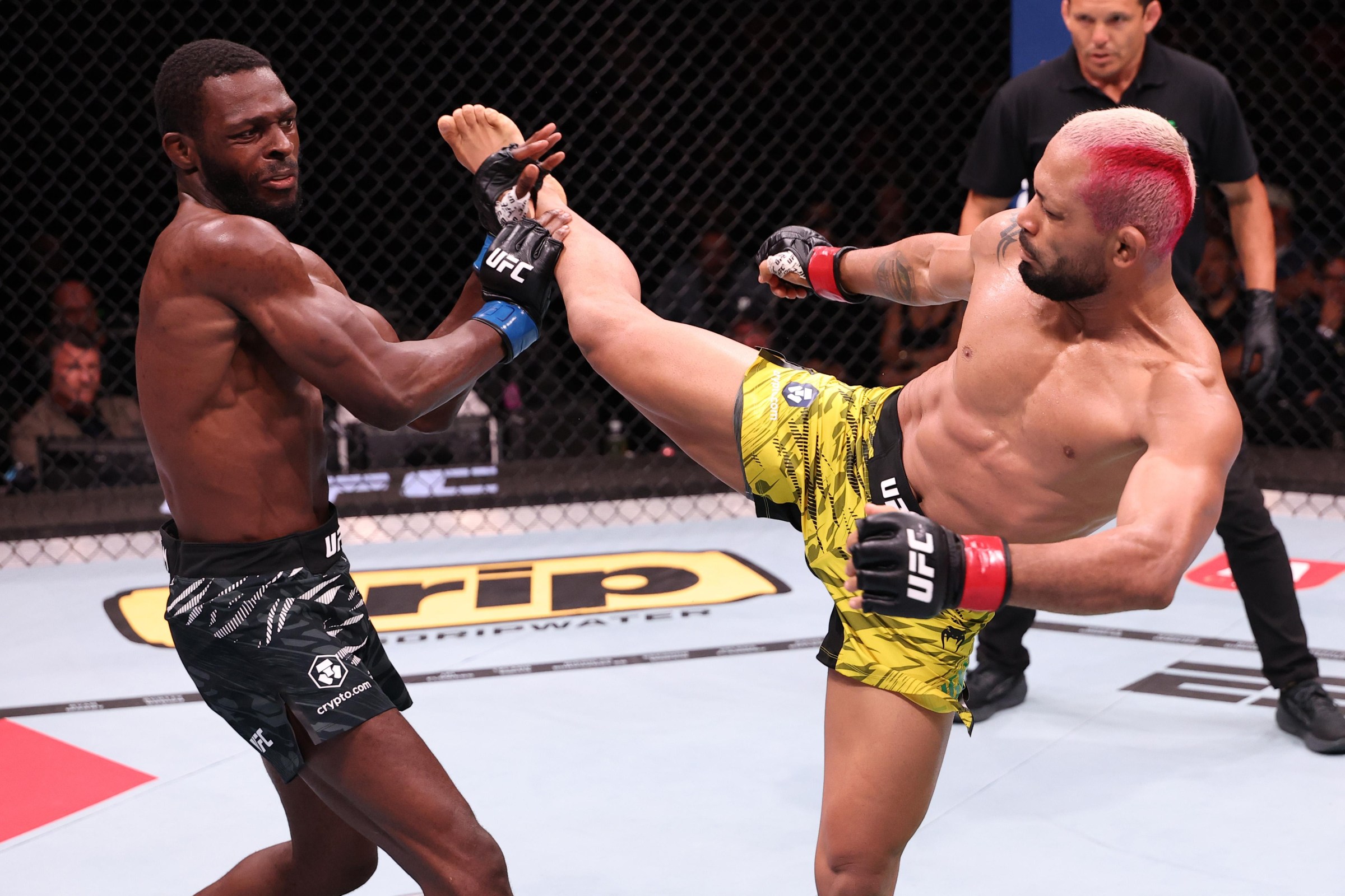 RIO DE JANEIRO, BRAZIL - OCTOBER 11: (L-R) Montel Jackson blocks a kick by Deiveson Figueiredo of Brazil in a bantamweight fight during the UFC Fight Night event at Farmasi Arena on October 11, 2025 in Rio de Janeiro, Brazil. (Photo by Ed Mulholland/Zuffa LLC)