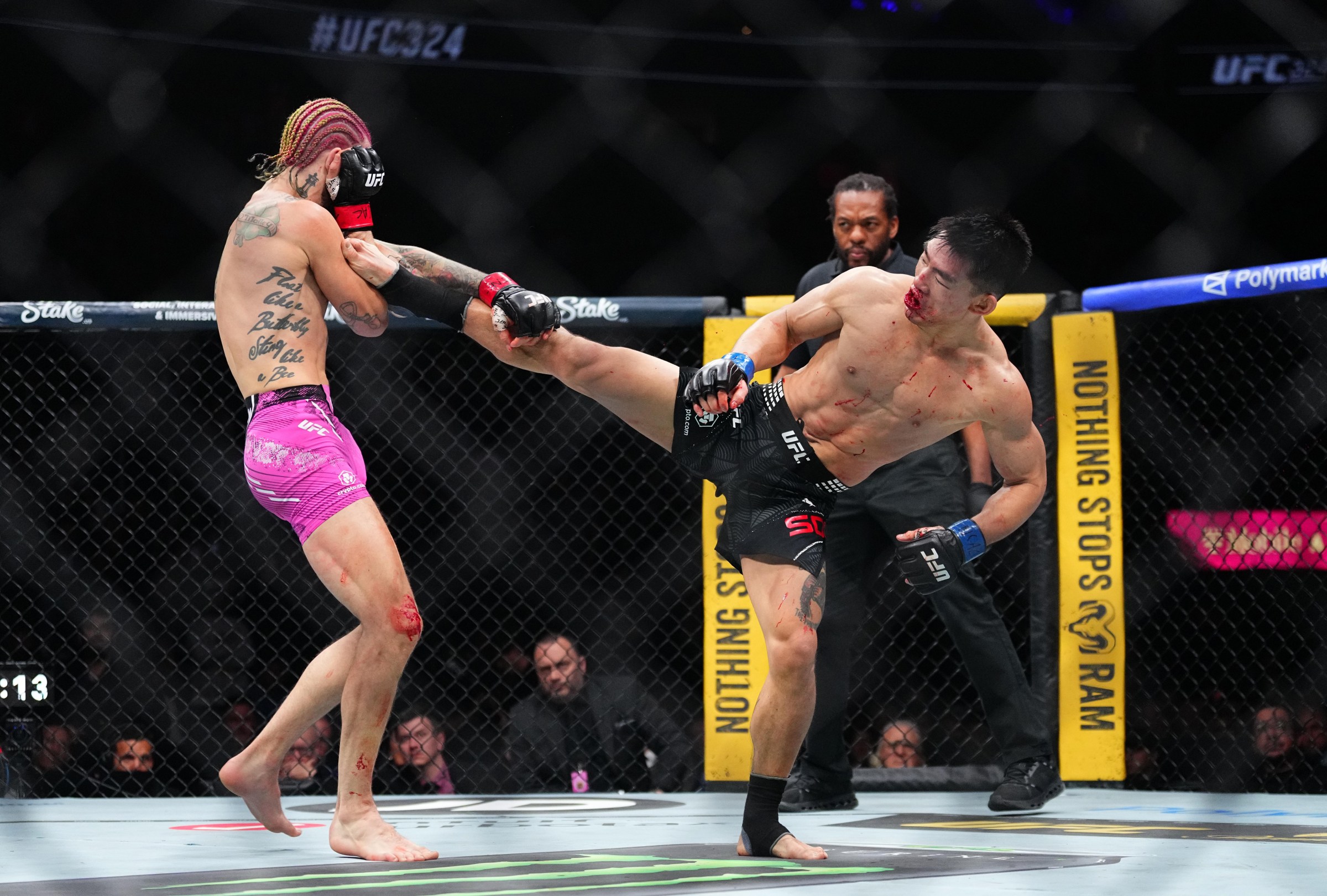 LAS VEGAS, NEVADA - JANUARY 24: (R-L) Song Yadong of China strikes Sean O’Malley in a bantamweight bout during the UFC 324 event at T-Mobile Arena on January 24, 2026 in Las Vegas, Nevada. (Photo by Jeff Bottari/Zuffa LLC)