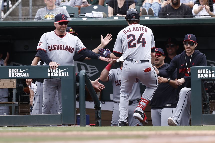 Cleveland Guardians manager Stephen Vogt high-fives Chase DeLauter after DeLauter hit a home run against the Athletics on May 3. Vogt won the American League's Manager of the Year Award in 2025.