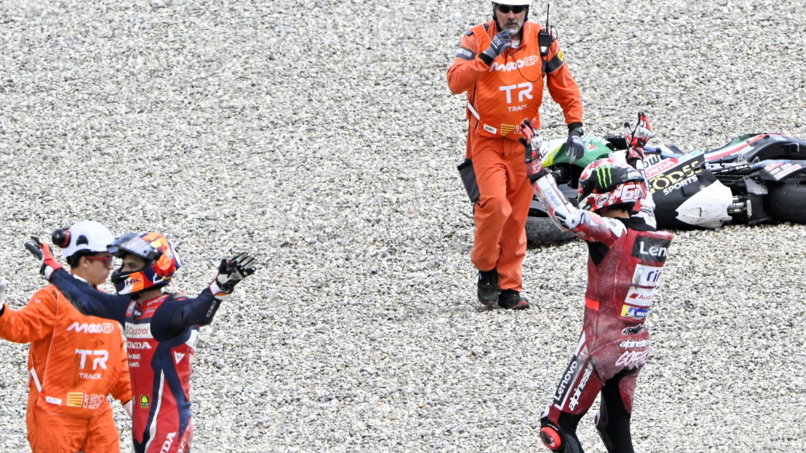 Marini, Bagnaia call for assistance for Zarco after Turn 1 crash, 2026 Catalan MotoGP.