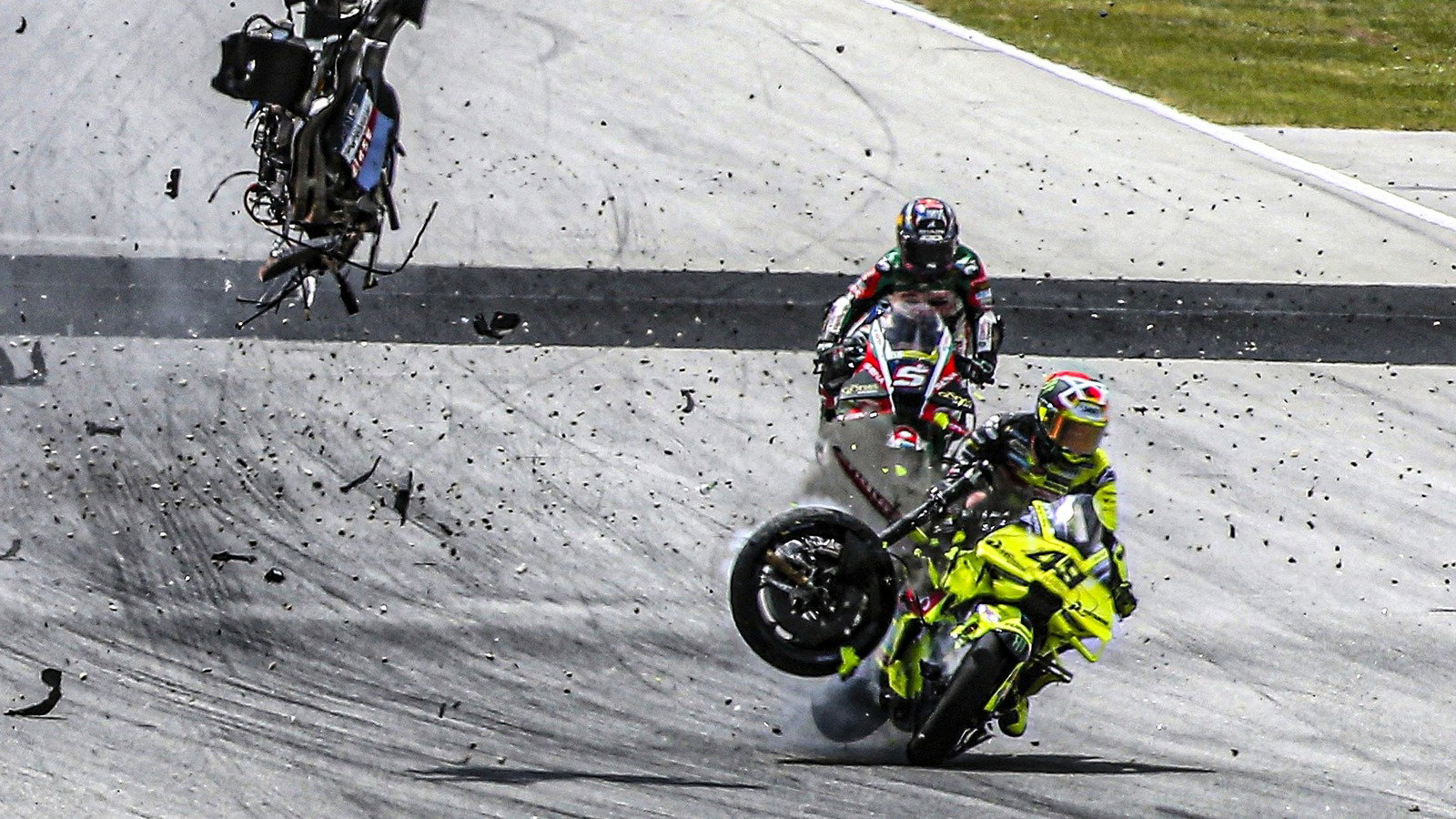 Fabio di Giannantonio hit by debris from Alex Marquez's bike, 2026 Catalan MotoGP.