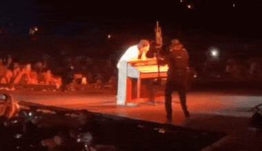 Country singer Morgan Wallen flips over and breaks piano on stage