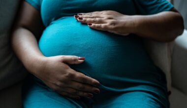 Pregnant woman touching her belly