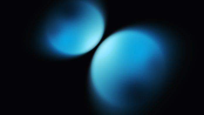 Two blue spheres coming closer together