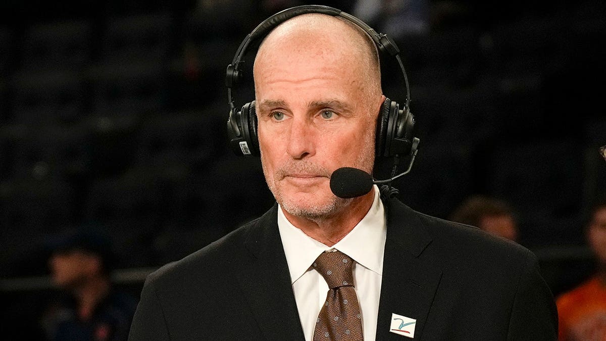 ESPN analyst Jay Bilas standing courtside at Madison Square Garden