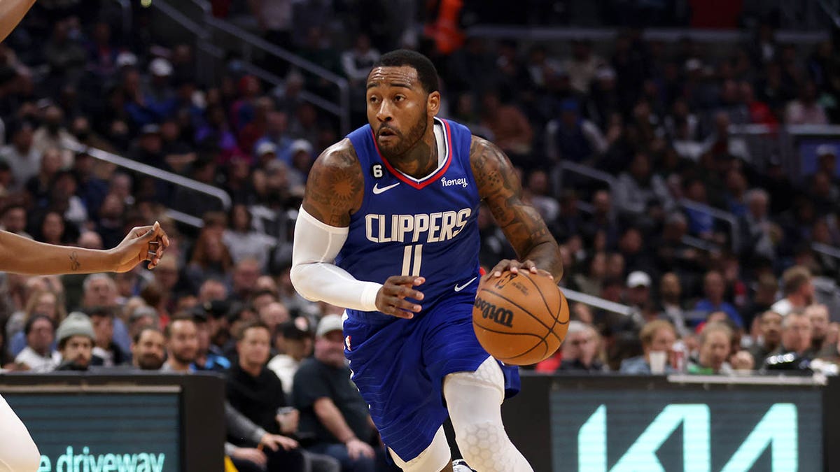 Los Angeles Clippers guard John Wall drives to the basket